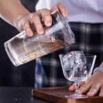 cocktail shaker with recipe for home bar use