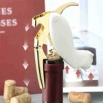 Using Cat Shaped Bottle Opener to Open Red Wine Bottle in Elegant Bar Setting