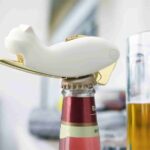Using Cat Shaped Bottle Opener to Open Beer Bottle at Casual Bar or Party