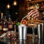 Bartender Using Precision Bent Tip Cocktail Tweezer for Delicate Garnish Placement in Luxury Bar